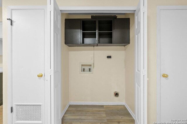 6123 Farragut, San Antonio, TX 78238 - clothes washing area with washer hookup, electric dryer hookup, wood finished floors, and baseboards