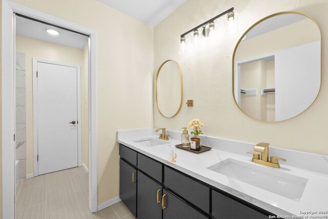 6123 Farragut, San Antonio, TX 78238 - bathroom featuring double vanity and baseboards