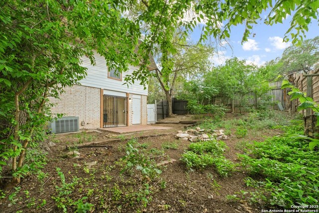 6123 Farragut, San Antonio, TX 78238 - fenced backyard featuring central AC unit and a patio area