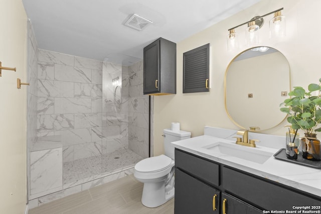 6123 Farragut, San Antonio, TX 78238 - bathroom featuring toilet, a tile shower, and vanity