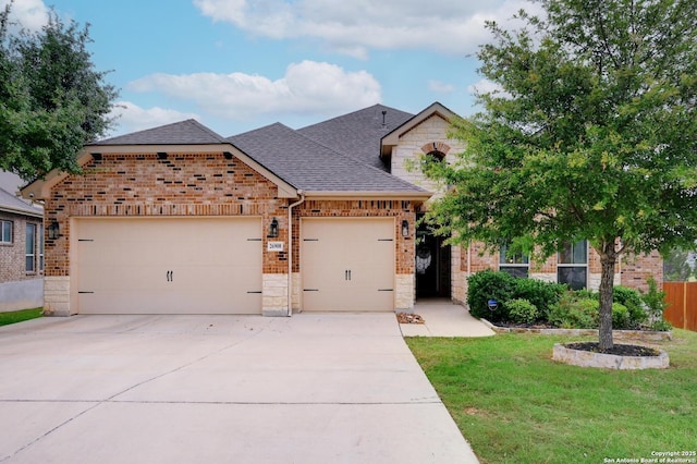 26908 Lavender Arbor, Boerne, TX 78015 - view of front facade with a shingled roof, a garage, brick siding, and stone siding