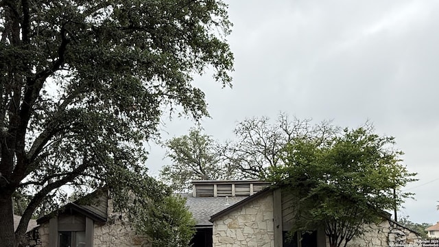 10339 Mount Michelle, San Antonio, TX 78213 - exterior view of stone siding and roof with shingles