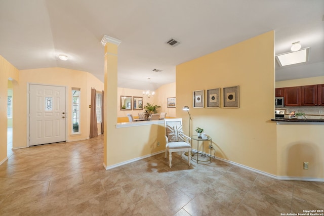 11819 Wheathill, San Antonio, TX 78253 - entryway featuring vaulted ceiling, a chandelier, baseboards, light tile patterned flooring, and ornate columns