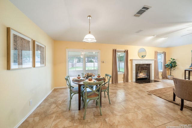 11819 Wheathill, San Antonio, TX 78253 - dining space featuring plenty of natural light, a fireplace, baseboards, and light tile patterned flooring