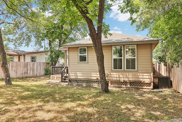 306 Joe Blanks St, San Antonio, TX 78237 - back of house with central air condition unit and a shingled roof
