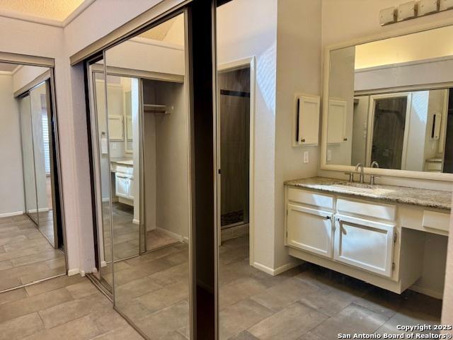 5739 Spring Moon, San Antonio, TX 78247 - bathroom with vanity and baseboards