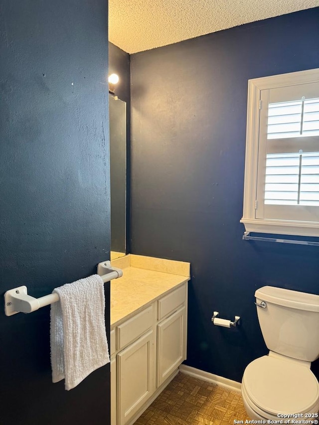 5739 Spring Moon, San Antonio, TX 78247 - bathroom with toilet, baseboards, and vanity