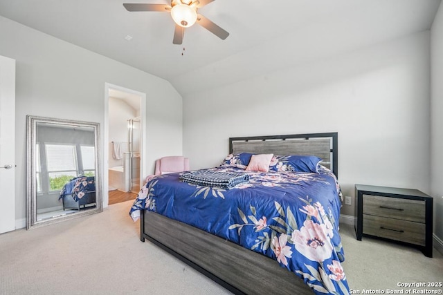 355 Jereth, Castroville, TX 78009 - carpeted bedroom featuring vaulted ceiling, baseboards, connected bathroom, and ceiling fan