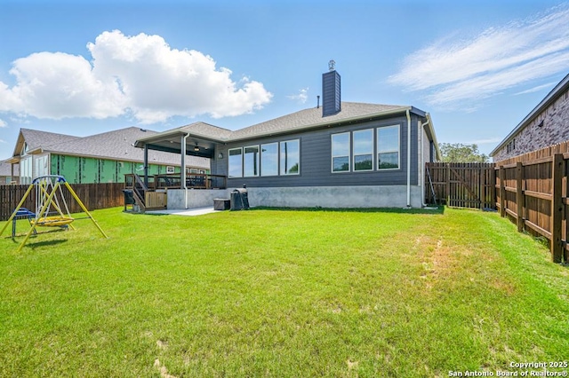 355 Jereth, Castroville, TX 78009 - back of house with a ceiling fan, a chimney, and a patio