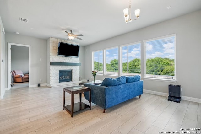355 Jereth, Castroville, TX 78009 - living room with baseboards, plenty of natural light, light wood finished floors, and a ceiling fan