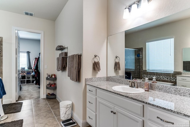 29121 Ismorada, San Antonio, TX 78260 - full bathroom featuring a shower stall, tile patterned flooring, vanity, and baseboards