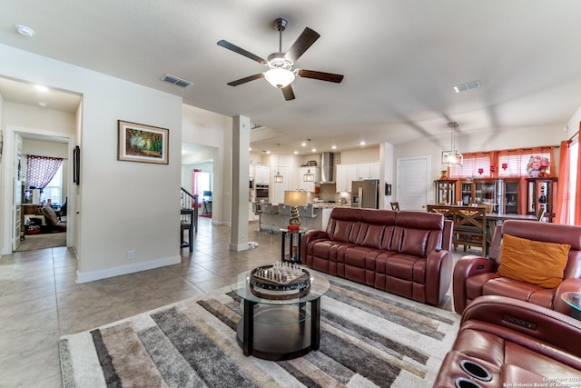 29121 Ismorada, San Antonio, TX 78260 - living room featuring a ceiling fan, baseboards, and light tile patterned floors