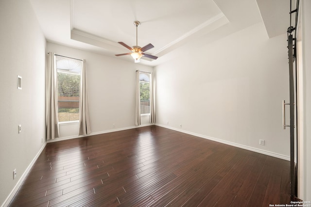 17026 Darien Wing, San Antonio, TX 78247 - spare room featuring a tray ceiling, a ceiling fan, dark wood finished floors, and baseboards