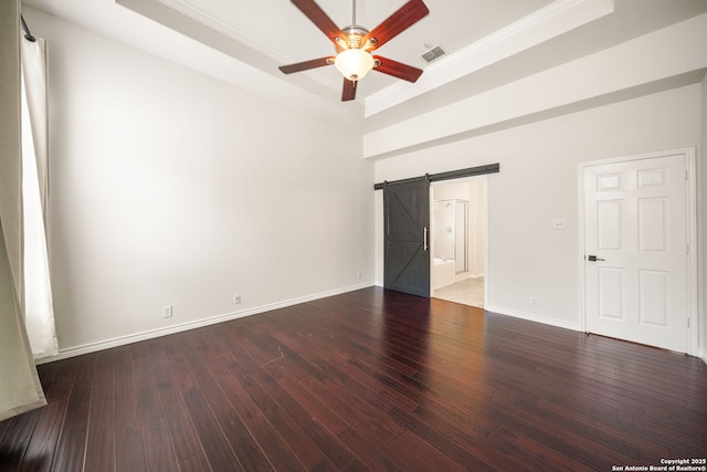 17026 Darien Wing, San Antonio, TX 78247 - unfurnished room featuring a barn door, a raised ceiling, ceiling fan, ornamental molding, and hardwood / wood-style flooring