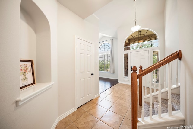 17026 Darien Wing, San Antonio, TX 78247 - entrance foyer with light tile patterned flooring, baseboards, and stairs