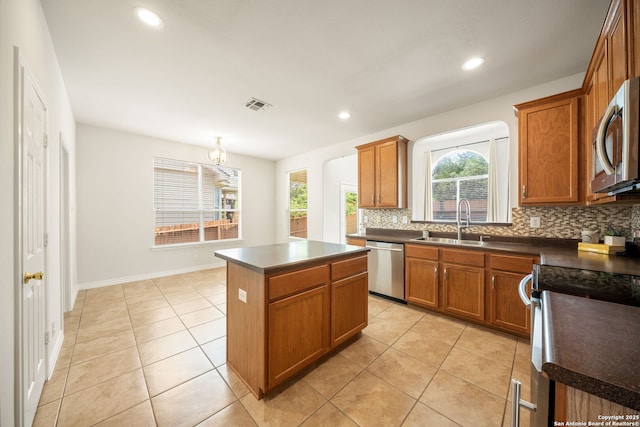 17026 Darien Wing, San Antonio, TX 78247 - kitchen featuring a sink, appliances with stainless steel finishes, backsplash, dark countertops, and recessed lighting