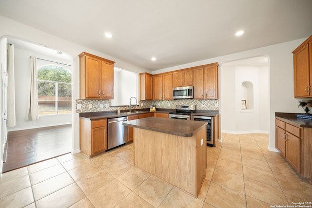 17026 Darien Wing, San Antonio, TX 78247 - kitchen with stainless steel appliances, wine cooler, dark countertops, backsplash, and recessed lighting