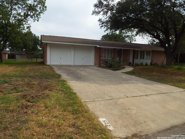 225 Zephyr, Windcrest, TX 78239 - ranch-style house featuring a garage, driveway, and brick siding