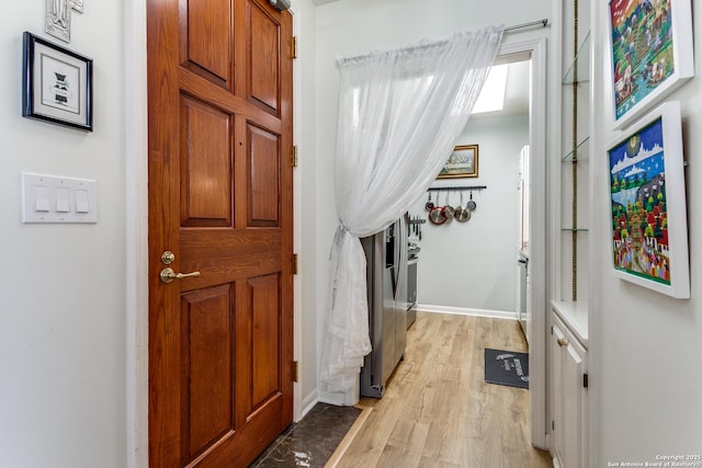 1 Towers Park Ln Unit 907, San Antonio, TX 78209 - foyer entrance featuring light wood-style floors and baseboards