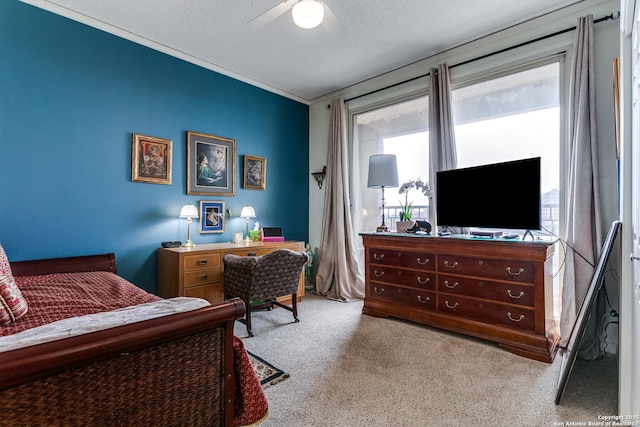1 Towers Park Ln Unit 907, San Antonio, TX 78209 - bedroom with carpet flooring, a ceiling fan, a textured ceiling, and ornamental molding