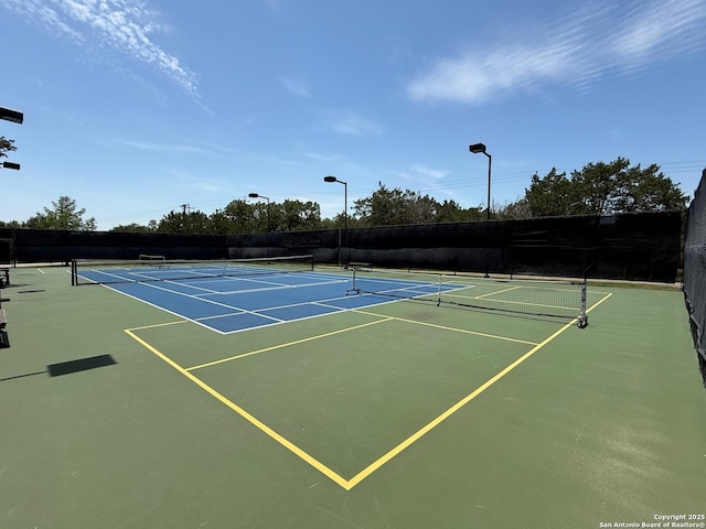4419 Tapia, San Antonio, TX 78261 - view of tennis court featuring community basketball court and fence