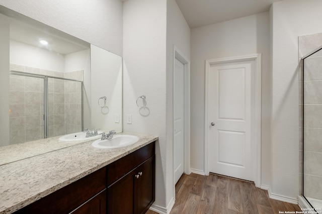 13915 Jasperoid, San Antonio, TX 78253 - full bathroom with wood finished floors, a tile shower, and vanity