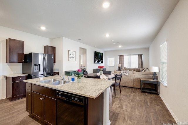 13915 Jasperoid, San Antonio, TX 78253 - kitchen with stainless steel refrigerator with ice dispenser, dishwasher, a sink, dark brown cabinets, and wood finished floors