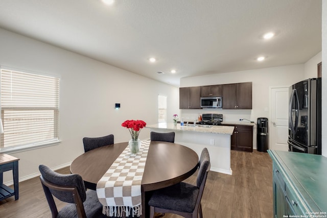 13915 Jasperoid, San Antonio, TX 78253 - dining room featuring wood finished floors, recessed lighting, and baseboards