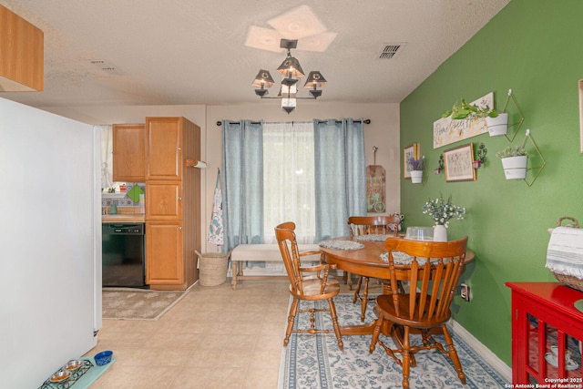 926 Zwicke, Seguin, TX 78155 - dining room featuring a textured ceiling and light floors