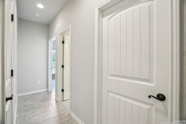 346 Broken Arrow, Floresville, TX 78114 - corridor featuring baseboards and light tile patterned floors