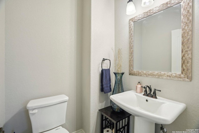 346 Broken Arrow, Floresville, TX 78114 - half bathroom with toilet and a sink