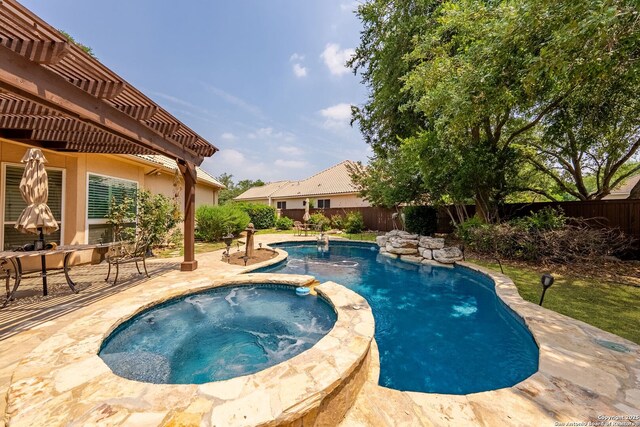 19114 Autumn, San Antonio, TX 78258 - view of pool featuring a patio, a fenced backyard, and a pool with connected hot tub