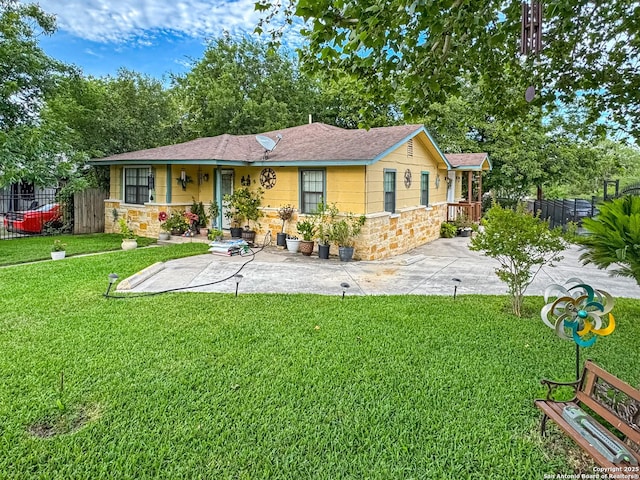 602 Hortencia Ave, San Antonio, TX 78237 - back of house featuring stone siding and roof with shingles