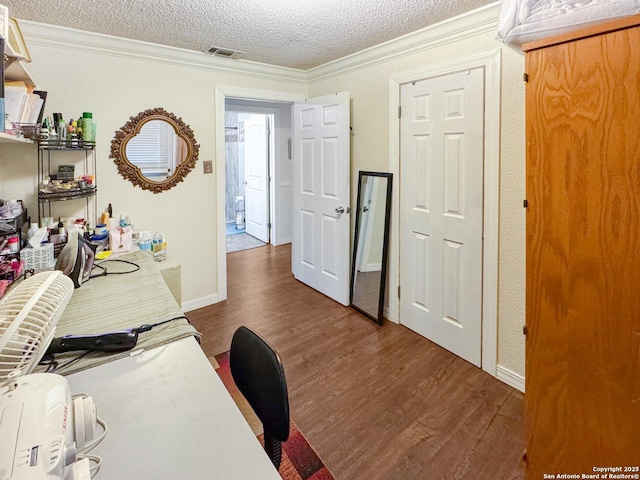 602 Hortencia Ave, San Antonio, TX 78237 - office area with dark wood-style flooring, ornamental molding, and a textured ceiling