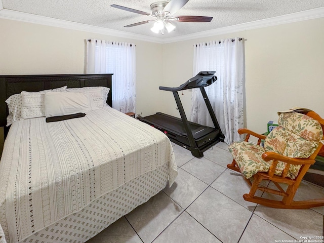 602 Hortencia Ave, San Antonio, TX 78237 - bedroom featuring crown molding, light tile patterned flooring, a textured ceiling, and a ceiling fan