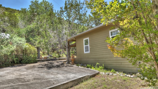 211 Roy Chisum Rd, Leakey, TX 78873 - view of side of property featuring a patio