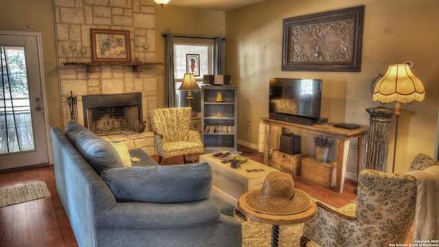 211 Roy Chisum Rd, Leakey, TX 78873 - living area with wood finished floors, a fireplace, and baseboards