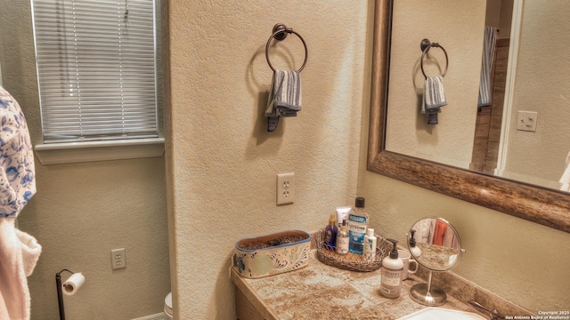 211 Roy Chisum Rd, Leakey, TX 78873 - half bathroom featuring toilet and vanity
