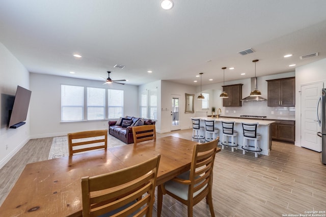 12531 Yancey, San Antonio, TX 78253 - dining area featuring a ceiling fan, light wood finished floors, baseboards, and recessed lighting