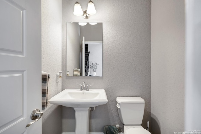 27210 Camellia, Boerne, TX 78015 - bathroom featuring a textured wall and toilet
