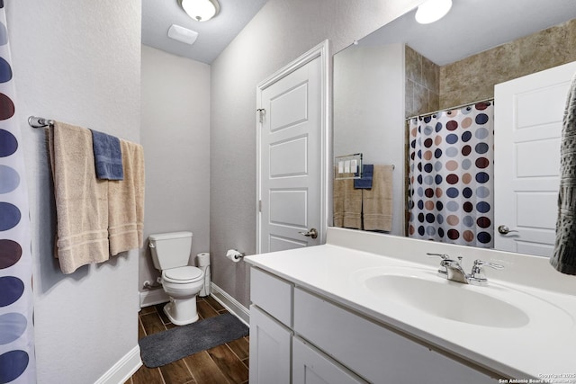 27210 Camellia, Boerne, TX 78015 - bathroom featuring wood tiled floors, toilet, baseboards, vanity, and a shower with shower curtain