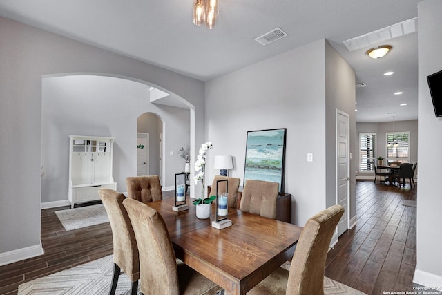 27210 Camellia, Boerne, TX 78015 - dining space featuring dark wood-style flooring, baseboards, arched walkways, and recessed lighting