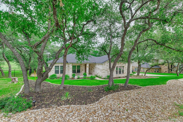 view of front of house featuring roof with shingles and brick siding