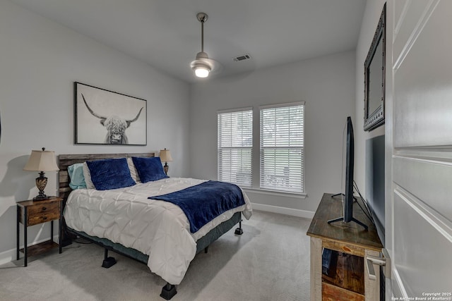 bedroom with baseboards, light carpet, and ceiling fan