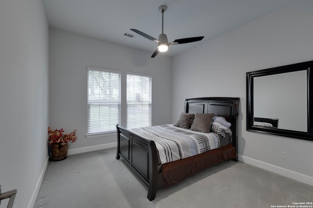 bedroom featuring light carpet, baseboards, and ceiling fan