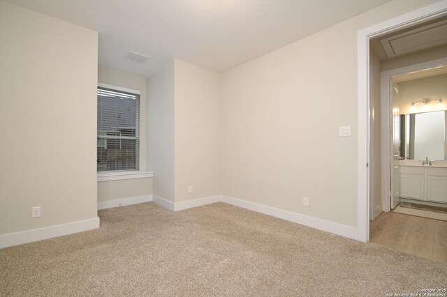 4609 Shackelford, Schertz, TX 78108 - empty room with light colored carpet, baseboards, and a sink