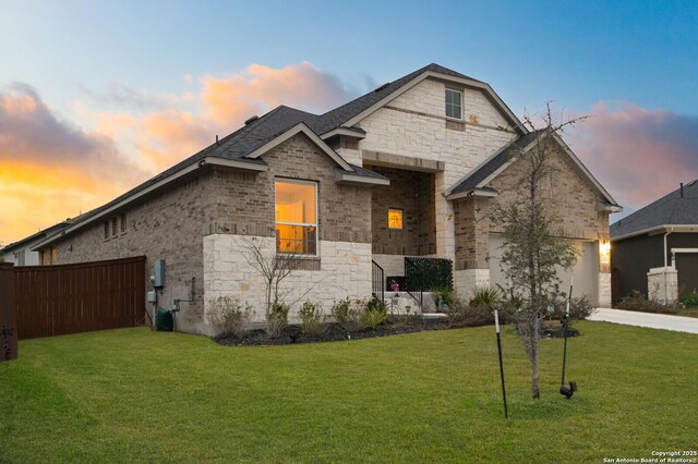 4609 Shackelford, Schertz, TX 78108 - view of front of property featuring stone siding, driveway, brick siding, and a garage