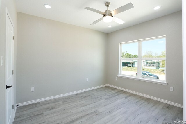 656 Canyon Cir, Canyon Lake, TX 78133 - unfurnished room with light wood finished floors, ceiling fan, recessed lighting, and baseboards