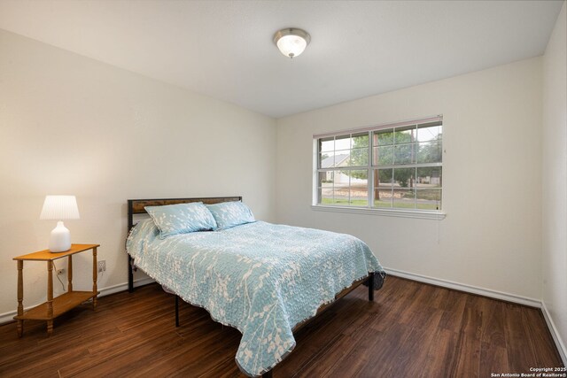 104 Holly Hl, Ingram, TX 78025 - bedroom with baseboards and wood finished floors