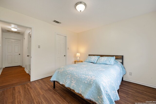 104 Holly Hl, Ingram, TX 78025 - bedroom featuring wood finished floors and baseboards